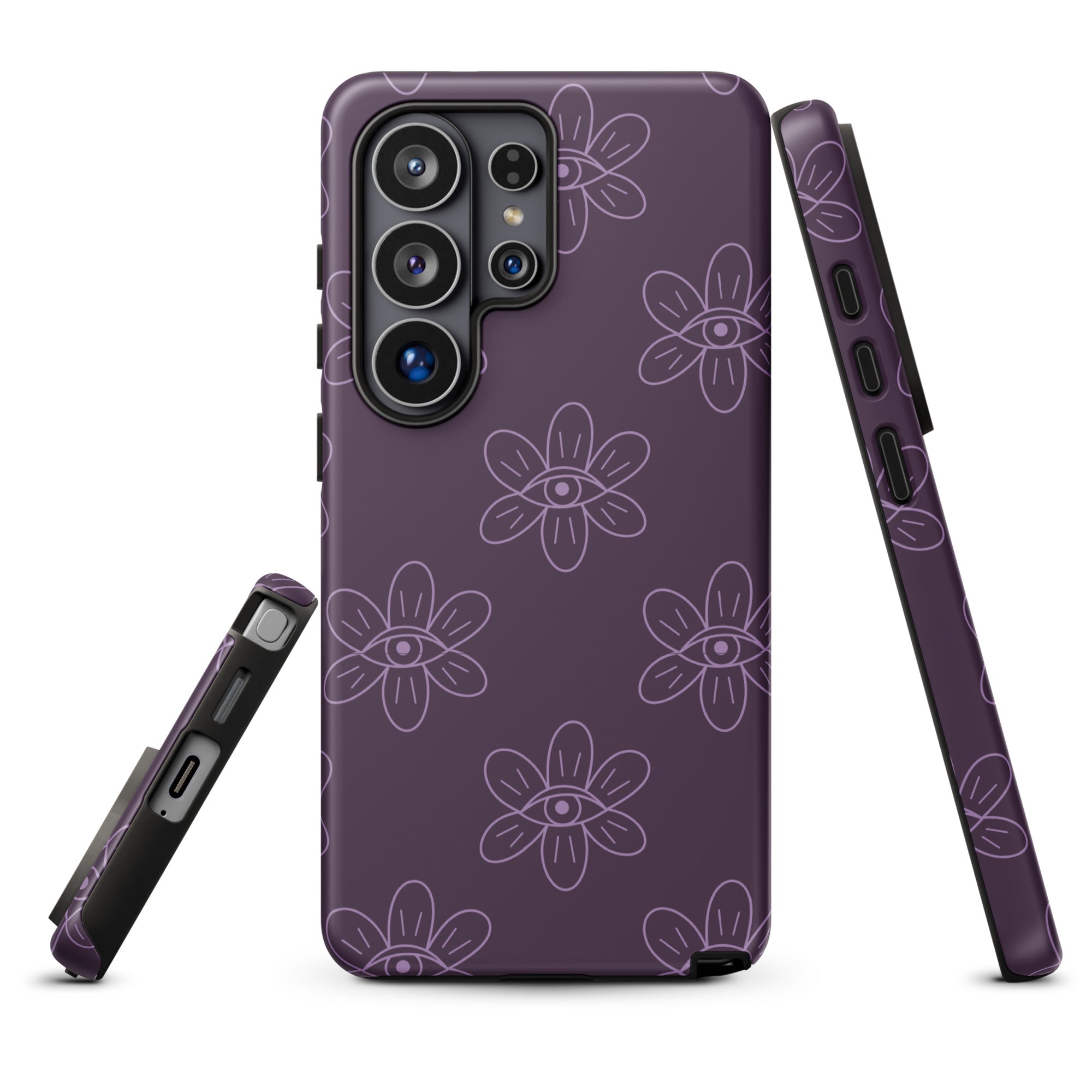 a purple phone case with a floral pattern and eyes resembling all seeing eye.