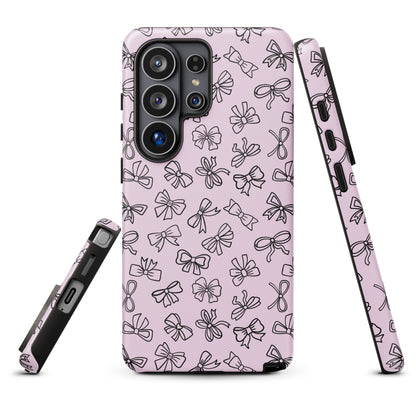 a pink phone case with a repeating pattern of black bows on it.